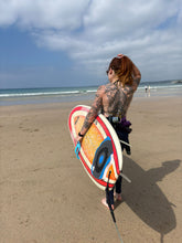 Load image into Gallery viewer, Surfer carrying board using Surf Claw surfboard handle